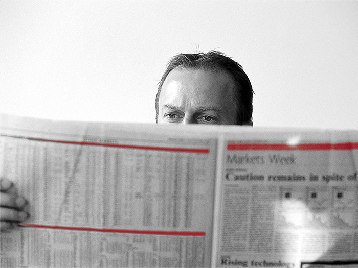 man_behind_newspaper_4-3.jpg